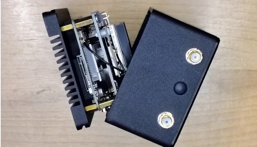 Nebra housing lifted, exposing the boards and MicroSD slot