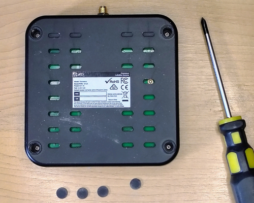 Install the top cover, flip the miner over, install the 4 retaining screws, and cover them with the rubber foot pads